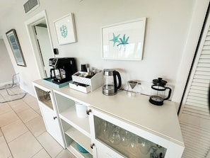 Coffee station with carafe/k-cup machine, French press, pour over drip coffee and tea kettle. I provide an assortment of coffee and tea accompaniments.