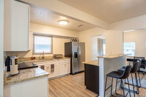 kitchen with bar and chairs