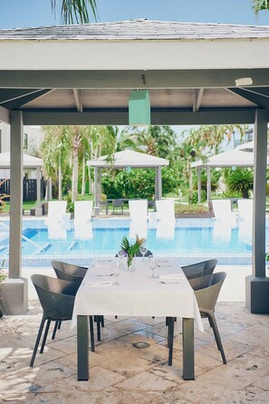 Dine poolside for breakfast, lunch, and dinner