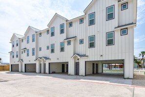 Outdoors - Ample parking for 4 standard sized vehicles under the carport