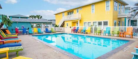 Spacious community pool with lounge chairs