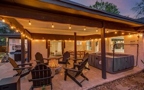 Take advantage of this BBQ grill and enjoy al fresco dining under the stars! It’s the ultimate indoor/outdoor lifestyle with string lights, a hot tub, and a fire pit!