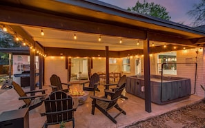 Take advantage of this BBQ grill and enjoy al fresco dining under the stars! It’s the ultimate indoor/outdoor lifestyle with string lights, a hot tub, and a fire pit!