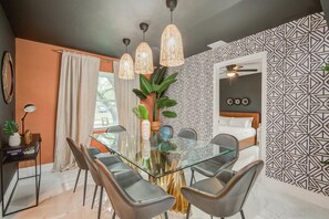 With its bold, geometric accent wall, this dining room has been designed to make a statement that’s as memorable as the meals you’re going to enjoy here!