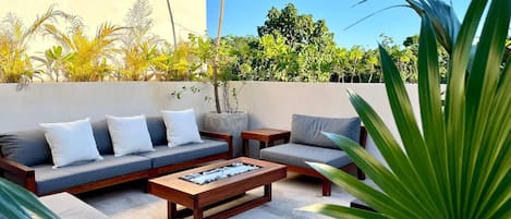 Relax on the private rooftop patio with unobstructed jungle views!