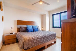 The master bedroom features a comfortable king size bed and ensuite bathroom