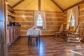 standing by the bed looking toward the opposite end of the cabin.