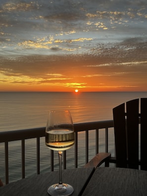 Capture breathtaking sunsets from the expansive private balcony.