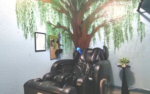Relax in luxury with our Cozzia CZ-628 massage chair, set beneath a stunning hand-painted willow tree mural that wraps around two walls. This tranquil corner creates a spa-like oasis, perfect for easing sore muscles and unwinding after your Dallas adventu