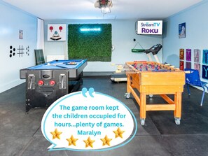 Welcome to your ultimate game room experience! Snap a photo at the vibrant clover wall with a “Welcome to Dallas” sign, then dive into fun with pool, foosball, magnetic tic-tac-toe, and a sensory wall designed for kids and adults alike. A 48" TV adds the 