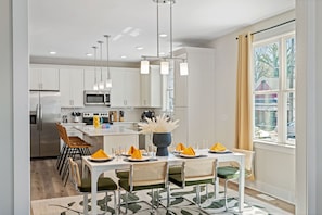 Dining area and kitchen is nearby each other