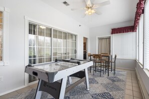 Extra seating and games in the Sun Room Plus a Golf Course View!