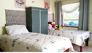 The twin beds can be conjoined for a queen bed experience
