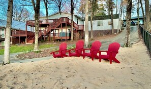 Relax on your private sandy beach & comfy Adirondack chairs!