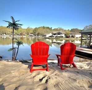 Relax & enjoy the view on your private sandy beach & comfy Adirondack chairs!