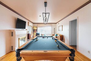 Relax in one of the game rooms with pool, pinball, and a TV.