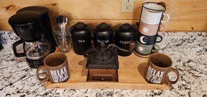 Start your day at The Little Red Cabin with a warm cup of comfort—choose from a selection of coffee or tea, complete with sugar to sweeten your moments of relaxation. 'Relax, you're at the cabin'—it's not just a saying, it's our way of life here.