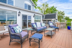 Comfortable outdoor lounge setup overlooking the lake—your perfect gathering spot under the sky.