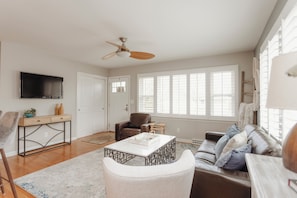 Upstairs living area with TV and seating