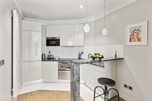 The kitchen is fully equipped to prepare a simple meal