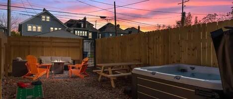 Hot tub, games, seating, cornhole- an outdoor oasis!