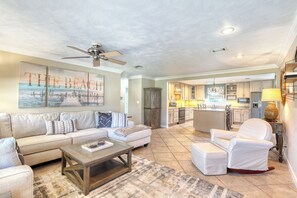 Open floor plan with living area and kitchen spaces combined