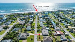 End of street beach access with seating benches at the ocean access