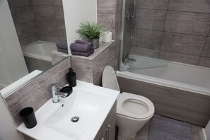 Full private bathroom - Toilet, sink, bath and shower. Heated towel rail.