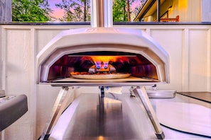 Make homemade craft pizzas in our Ooni Outdoor Pizza Oven - the possibilities are endless!