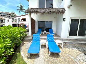 Long chairs at beach patio