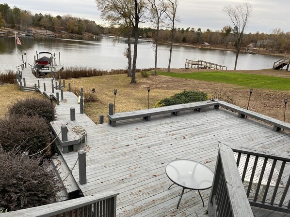 Large back deck with boardwalk to dock on lake