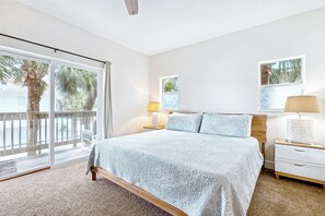 Cozy master bedroom w/ king size bed, soft linens, natural light and a private balcony retreat.