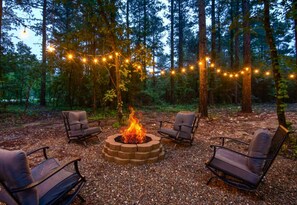 Gather around the crackling fire pit for smores and stories under a canopy of fairy lights and stars