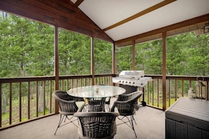 Covered porch perfect for grilling, gathering and taking in the views.