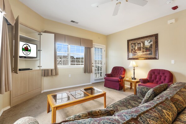 Living Room with Cable TV & Balcony Access