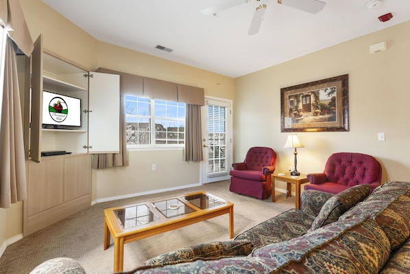 Living Room with Cable TV & Balcony Access