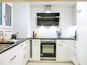 Countertop, Cabinetry, Property, Sink, Building, Kitchen Stove, Product, Tap, Kitchen, Kitchen Sink