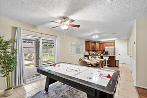 Air hockey table included.