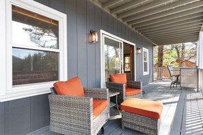 The lower deck has a cocktail table and a sitting area for enjoying the views and the fresh mountain air.