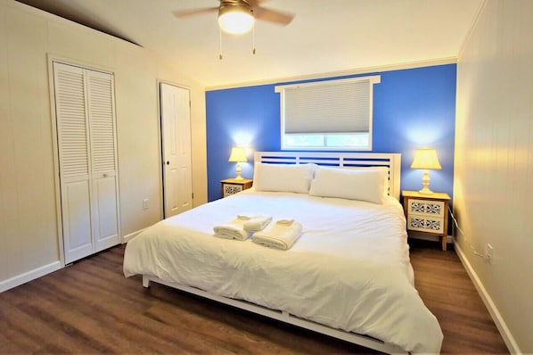 Sink into rest with a roomy bed, clean linens, a quiet ceiling fan, and room darkening blinds.