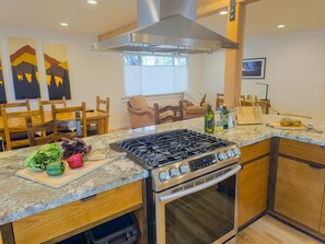 The kitchen offers a large gas range and oven, perfect for creating your parties favorite meals!