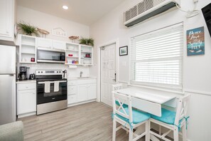 Kitchen opens up into living and dining room