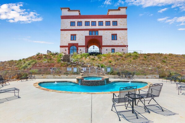 Soak up the sun from the unique pool at Arc De Texas - Louis XIV Suite