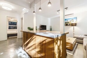 Entertain effortlessly with the kitchen island flowing into the living area, perfect for gatherings and relaxation.