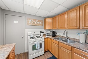 Enjoy the comforts of home in our well-appointed kitchen, fully stocked with everything you need to prepare and enjoy delicious meals together.