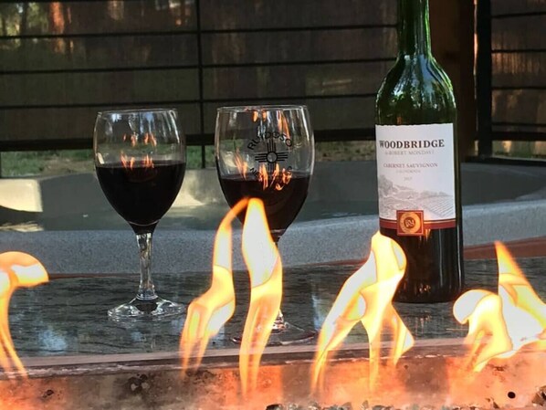 Outdoor fire table by the hot tub 
