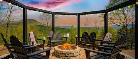 Unwind at our stunning fire pit area and enjoy the majestic mountain views. The fire's glow and the illuminated landscape at night provide a captivating backdrop, perfect for creating lasting