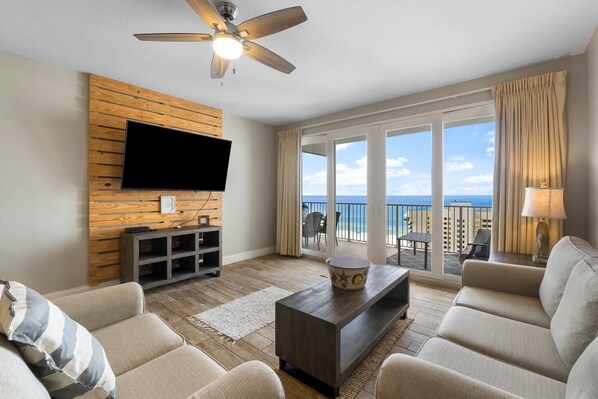 Living Area with Ocean Views, Sleeper Sofa, Large Flat Screen TV, and Private Balcony Access