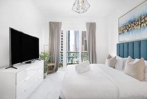 Bedroom Retreat: Stylish ambiance with stunning skyline views and a chic balcony for relaxation!