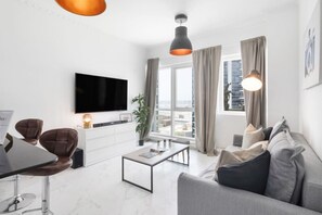 Living Room: Bright and airy space with stunning views and stylish decor for your relaxation!
